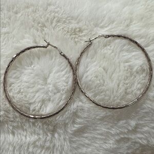 Italian Silver Hoop Earrings
Diamond cut 2 inch hops day to evening elegance.